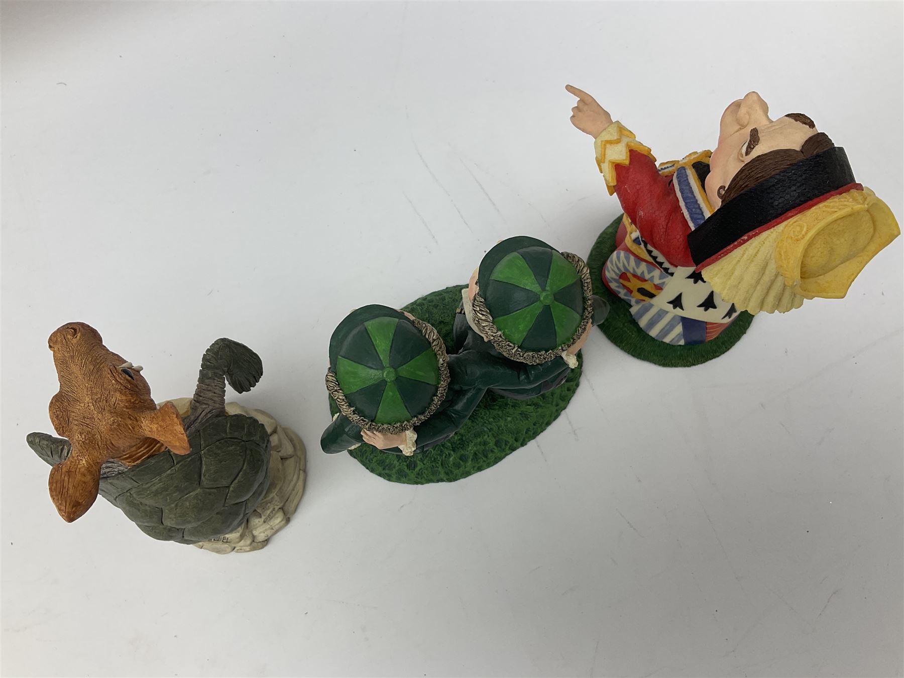 Goebel Alice in Wonderland figures, comprising Alice and Cat, White Rabbit, Queen of Hearts, March Hare, Tweedle Dee and the Mock Turtle, largest H18cm