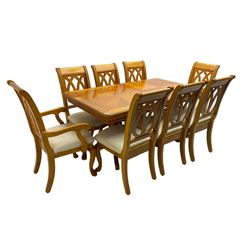 Yew wood extending twin pedestal dining table, rectangular top with ebony stringing over turned and reeded vasiform pedestals on tripod bases, with two additional leaves (W159cm D92cm); and set of eight (6+2) matching dining chairs, high pierced backs over seats upholstered in ivory fabric, on cabriole supports (W57cm H101cm)