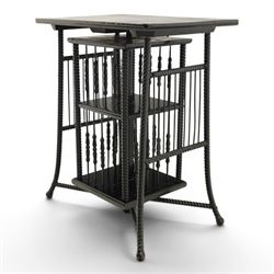 Edwardian black painted side table with incorporated revolving bookcase, supported on barley twist legs
