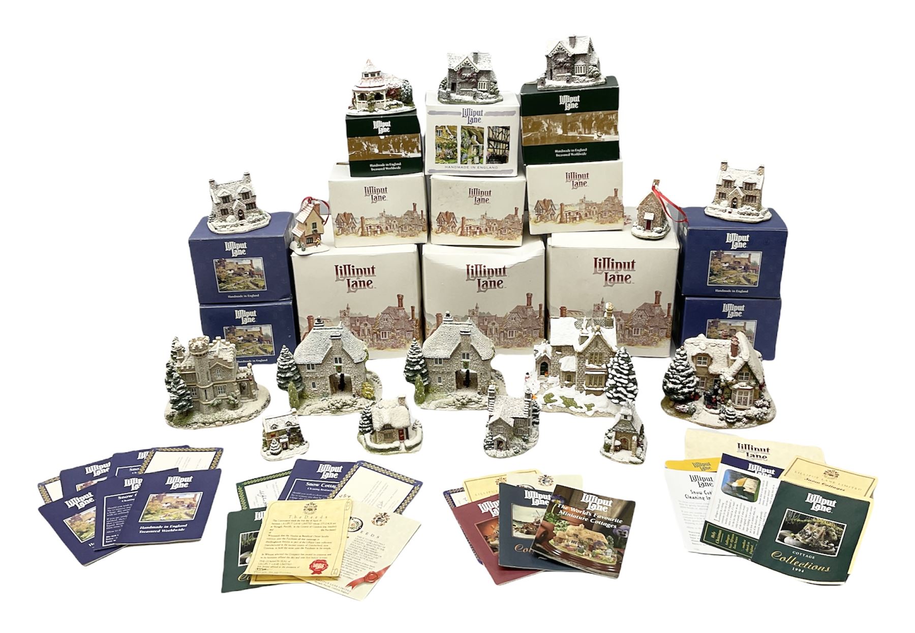 Sixteen Lilliput Lane models from Christmas collections, thirteen boxed and two loose, with various deeds, to include Snowdon Lodge, The Vicarage, Eamont Lodge etc