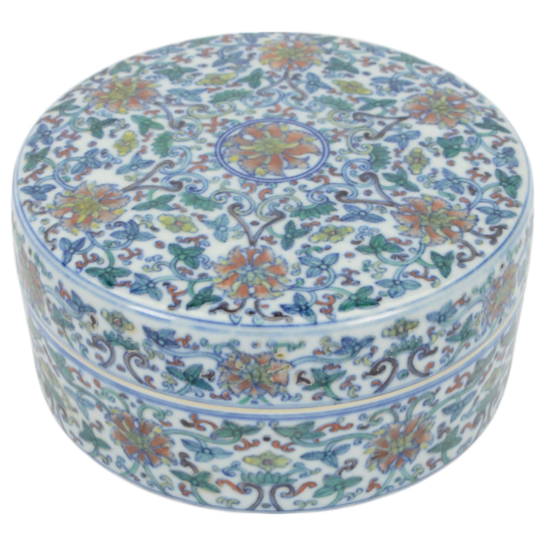 20th century Chinese Doucai box, of circular form, decorated in polychrome enamels with flowers and foliage, with character marks beneath, D18cm, H9cm