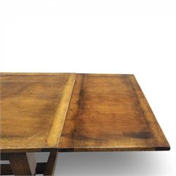 Titchmarsh & Goodwin - stained oak draw leaf dining table, raised on turned supports with H-stretcher, extends to 273cm