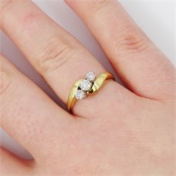 18ct gold diamond crossover ring, set three round brilliant cut diamonds, London 1991, total diamond weight 0.35 carat