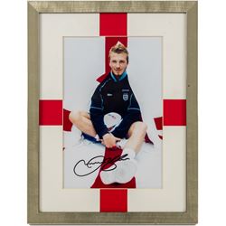 Signed photograph of David Beckham with certificate of authenticity from Auction World TV,...