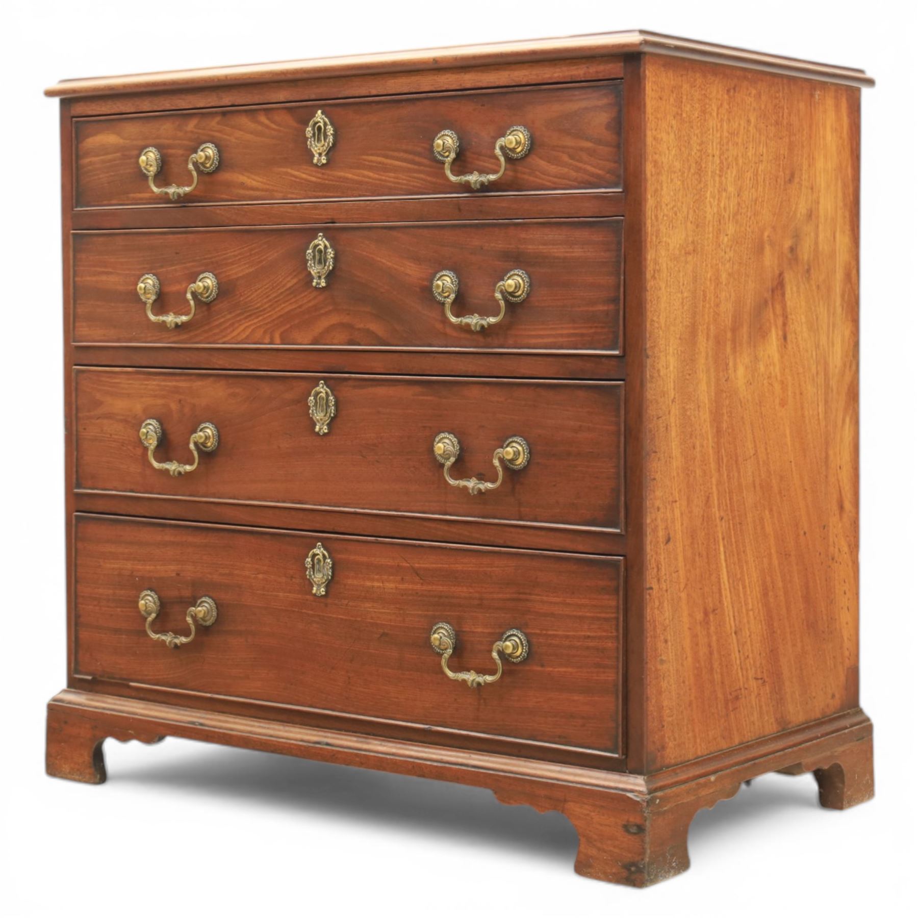 Georgian mahogany dwarf chest of drawers, the moulded rectangular top over four graduated drawers, fitted with brass drop handles, upon shaped bracket feet
