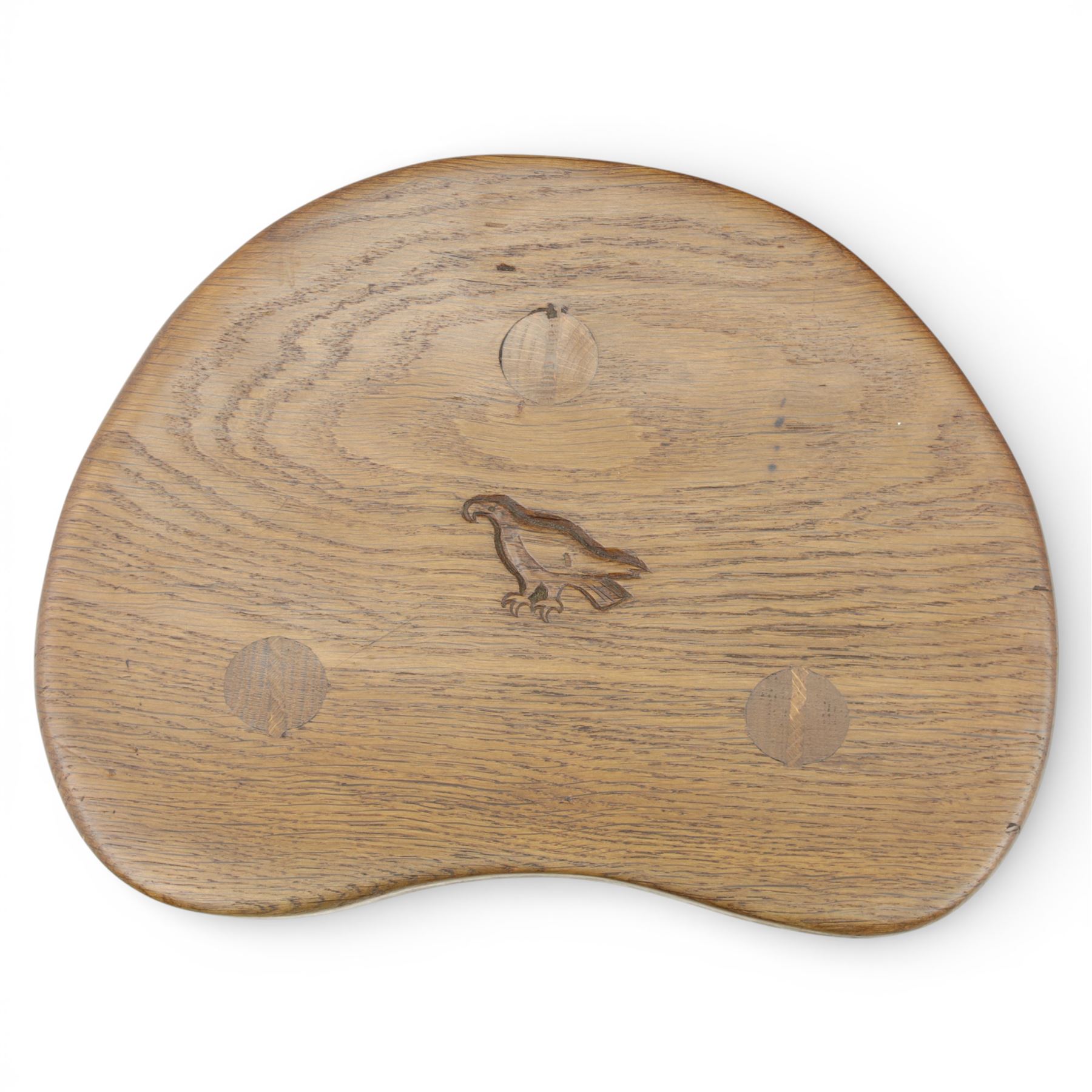 Eagleman - small oak calf stool, raised on three octagonal supports with signature Eagle motif to the seat from the workshop of Albert Jeffray, Sessay