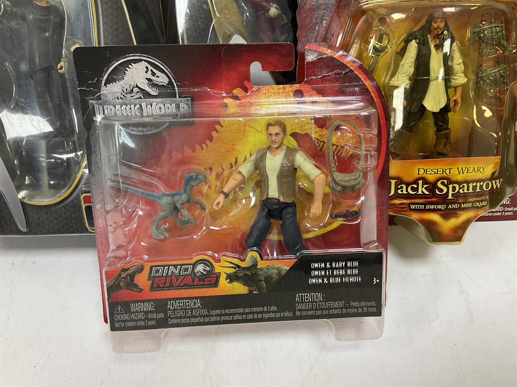 Seventeen TV & film related carded action figures comprising four Pirates of the Caribbean; five Shrek; three Star Trek; two Sea Quest DSV; Captain Scarlet, Warriors of Virtue; and Jurassic World; all in unopened blister packs (17)