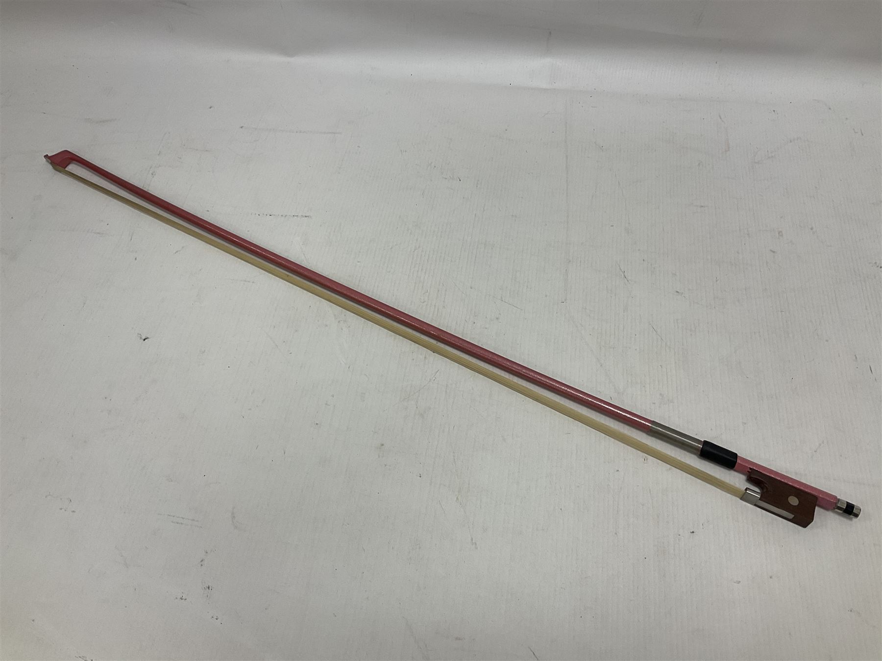 Zest full size pink violin, with a solid wood body and maple head, with matching pink bow and two further bows, in a hard case Length 60cm