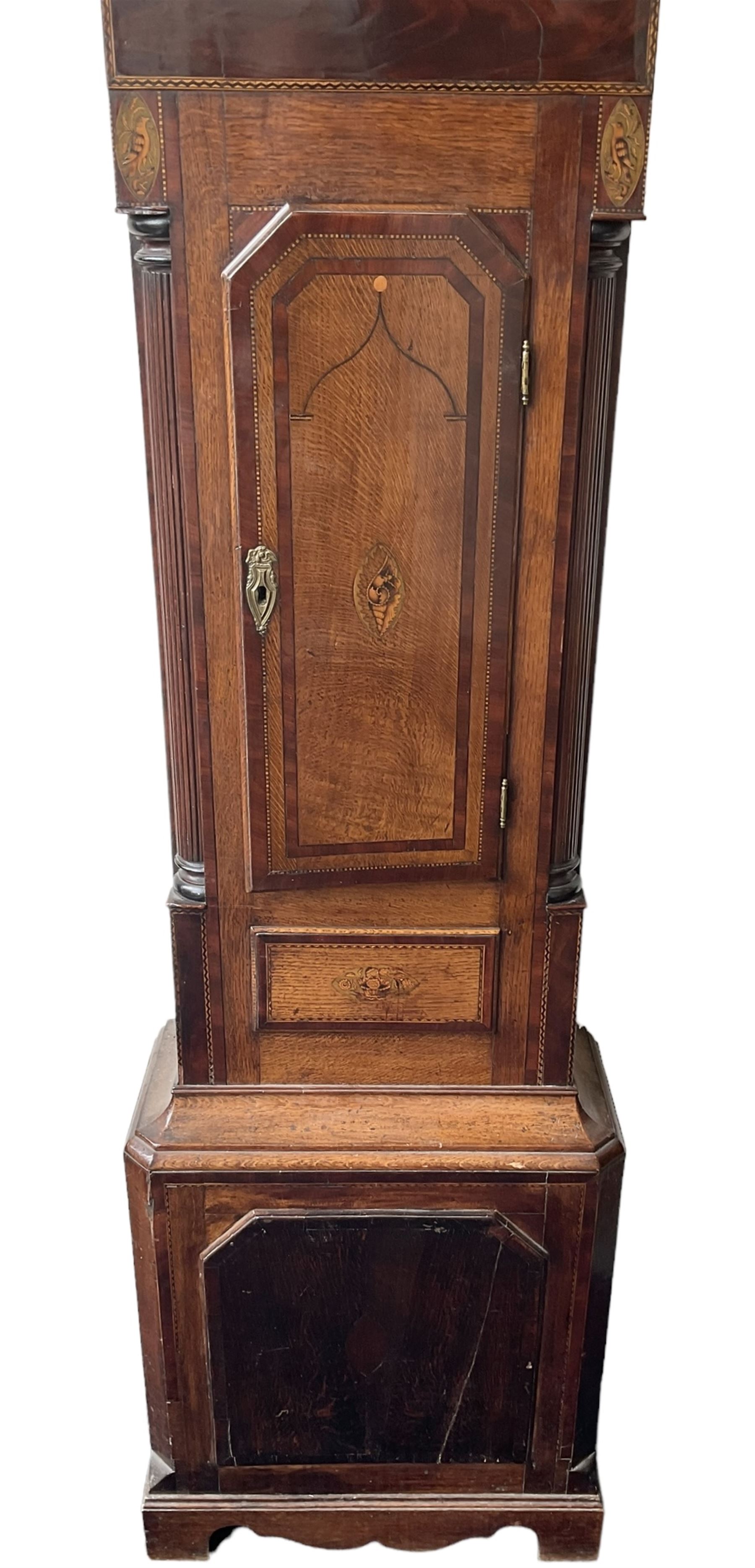Oak and Mahogany - 8-day longcase clock c1830 with a swan necked pediment and break arch hood door beneath flanked by reeded pilasters with Corinthian capitals,  trunk with three quarter reeded columns and a short door with canted corners, on a conforming plinth with a raised panel, painted dial with Arabic numerals, painted birds to the spandrels and a depiction of a soldier and encampment to the arch, with subsidiary calendar aperture and seconds dial, makers name indistinct, with a rack striking movement striking the hours on a bell.  No weights or pendulum.