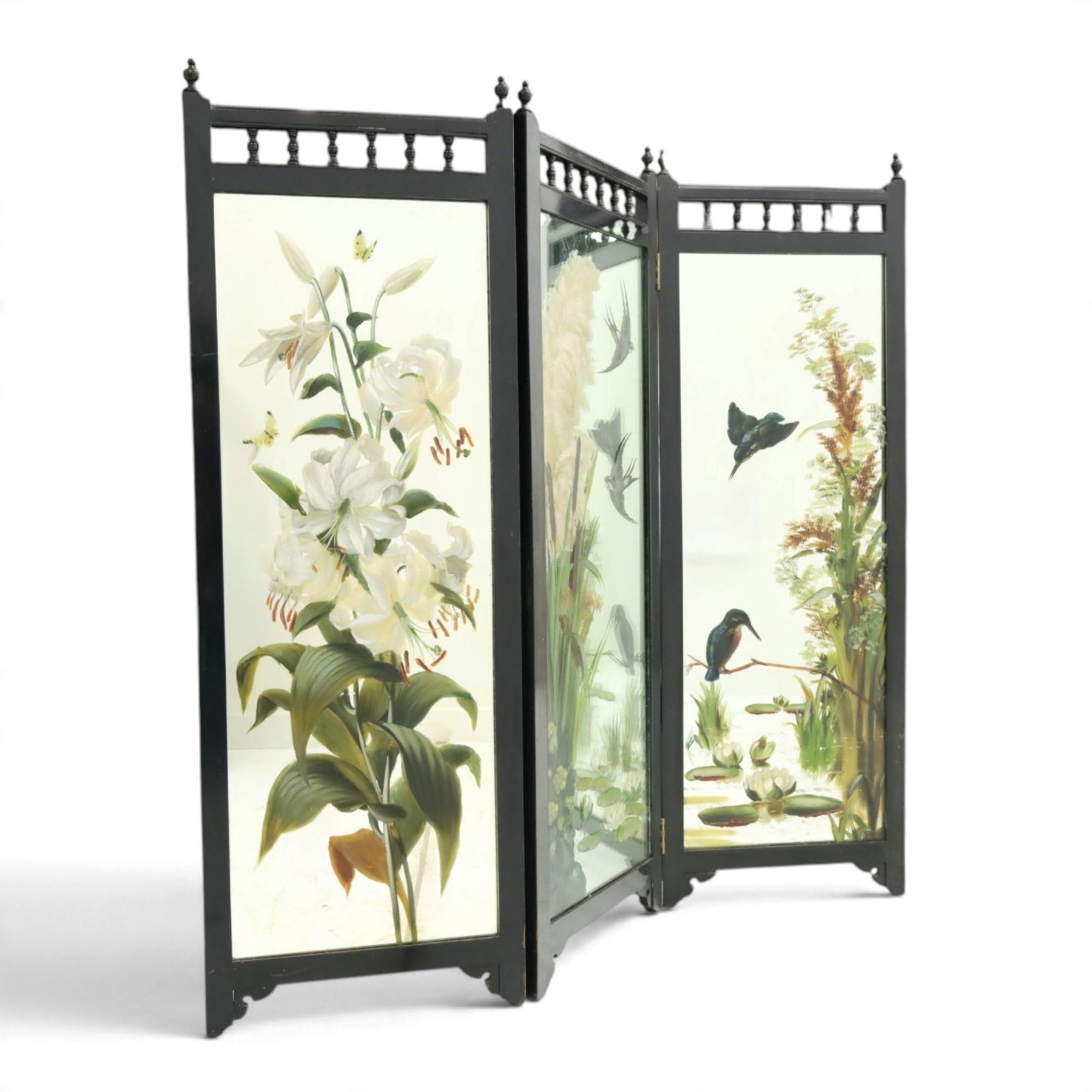 Late Victorian Aesthetic Movement ebonised and painted three-panel folding mirror screen, spindle gallery cresting rail over three rectangular mirror plates painted with floral pond scenes with lily-pads, swallows and kingfishers, each panel W37cm H110cm)