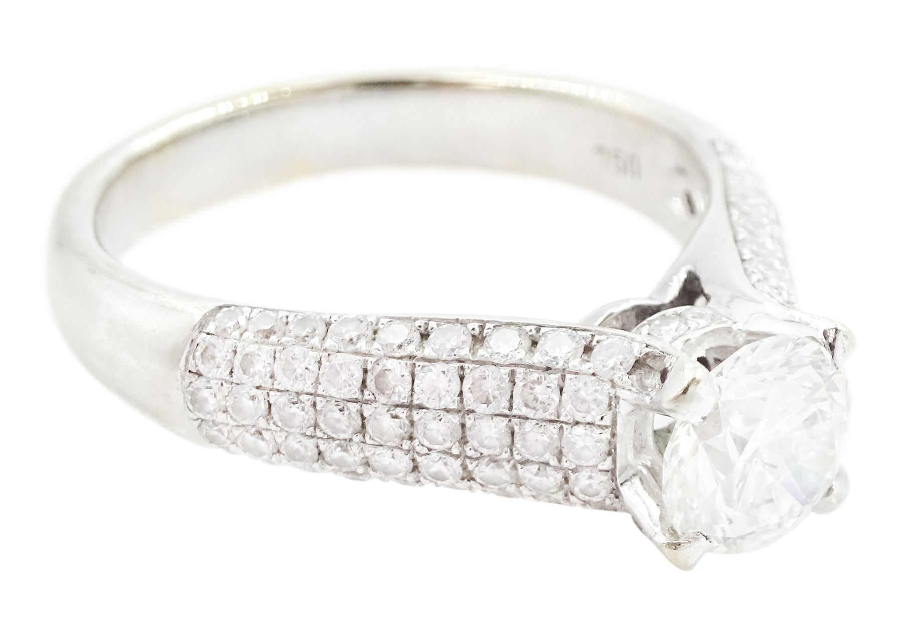 18ct white gold diamond ring, set with a single round brilliant cut diamond of approx 1.10 carat, five row pave set diamond shoulders and gallery, stamped 750, total diamond weight approx 1.50 carat