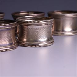 Six early 20th century French silver napkin rings, each with engraved initials, stamped with Minerva mark for 950 standard silver and maker's mark for Claude Doutre Roussel 