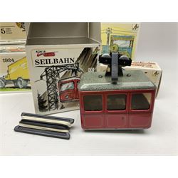 Kovap - eleven tinplate models to include Tractor and Trailer, Road Roller 1927, Moving Moneybox 1924, Hawkeye type B 1924, Boy on a Tricycle; all in original boxes 