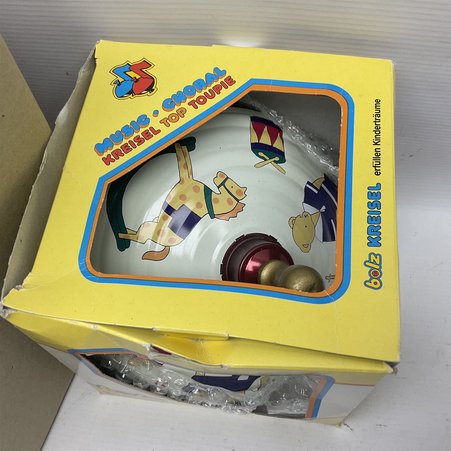 Twenty six tinplate models to include Ferris Wheel and Performing Circus Elephant, marked JW, further similar examples such as Duck on a Bike, Clown on Roller, Carousel; Popeye Tin Speedboat; Looney Tunes Wind Up Cars and Express Train; various international examples, MS107 Jumping Bambi, Pop Pop Boat, jumping frogs, pecking chickens etc; both boxed and loose