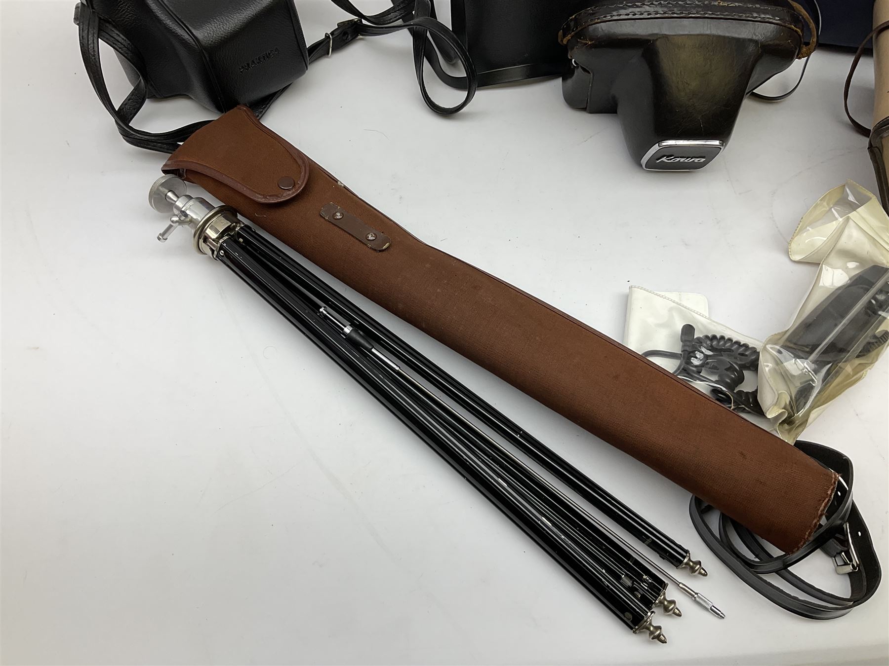 Quantity of Cameras , Lenses and Table Top Viewer- To be assessed 
Collection of cameras, lenses and photography equipment, to include Praktica EE2, Kowa SE, Kodak 66 model II, Inovar, lens Carl Zeiss Jena DDR Flektogon 2.4/35, lens Pentacon Electric f/2.8 135mm, Sunpak auto 2020, tripod  etc, together with a pair of Mark Scheffel 10x50 field binoculars.  