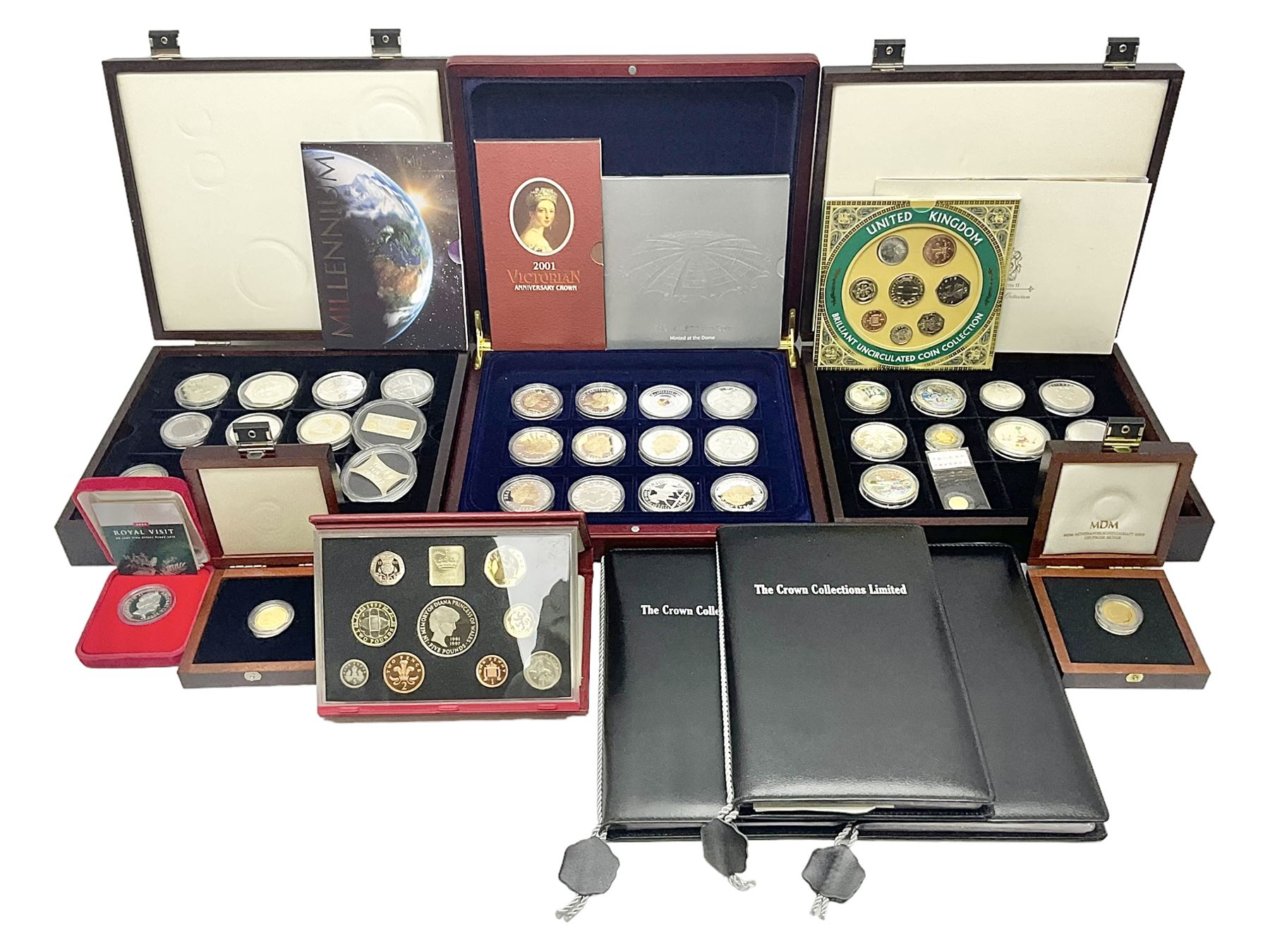 Single owner lifetime collection of mostly commemorative modern World coins with gold, silver and base metal examples, including two Queen Elizabeth II Bailiwick of Guernsey twenty-five pound gold coins 'The 1999 Royal Wedding' and '100th Anniversary of the End of the Victorian Era' 2001 each in 24 carat gold weighing 7.81 grams with certificates, silver coins commemorating the Millennium 2000 including Guyana sterling silver proof two-thousand dollars, Fiji sterling silver proof five dollars etc, silver coins from the Queen Elizabeth II Golden Jubilee Collection dated either 2002 or 2003 from Great Britain and the Commonwealth countries, United Kingdom commemorative crowns in card folders, The Royal Mint United Kingdom 1997 proof coin set in red folder without certificate etc