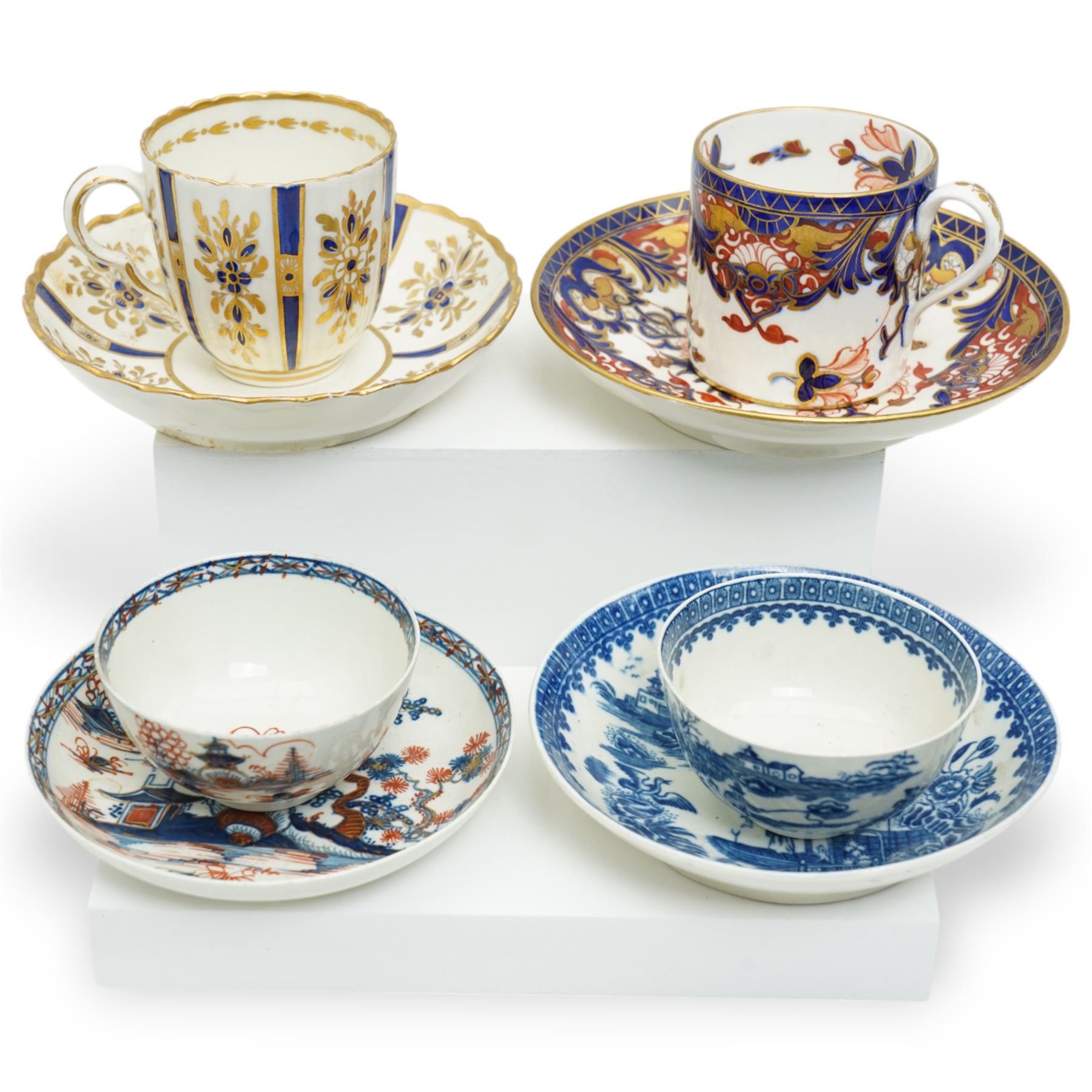 18th century Caughley tea cup and saucer of fluted design decorated in blue and gilt, blue 'S' mark, Bloor Derby coffee can and saucer in red, blue and gilt; 18th century Worcester tea bowls decorated in the Pleasure Boat or Fishermans pattern, and a Liverpool tea bowl decorated in the Penningtons Cannonball pattern