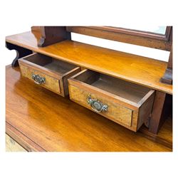 Victorian walnut bedroom suite - wardrobe, dressing chest and bedside cupboard, comprising a full-length wardrobe with broken pediment and central mirrored door, large lower drawer, a matching dressing table with bevelled swing mirror over two trinket drawers and two short drawers over two long drawers, and a single-door bedside cupboard, all with moulded edges, decorative panel work and shaped aprons