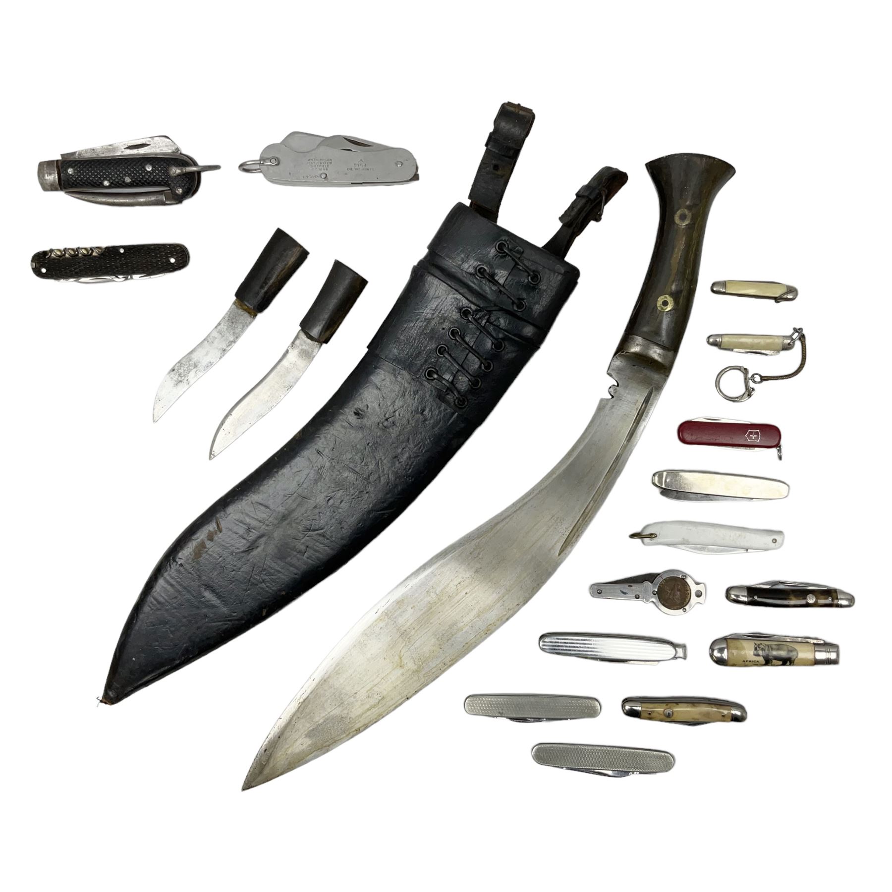 WW2 Gurkha Kukri knife with 34cm curving steel blade and horn handle; in leather covered scabbard with dual belt loops and two horn handled skinning knives L47cm overall; and collection of fourteen military and other folding and pocket knives including WW2 British Army clasp jacknife, J.H. Thompson C.C.1286 army knife dated 1954, Brookes & Crookes multiblade pocket knife etc (15)