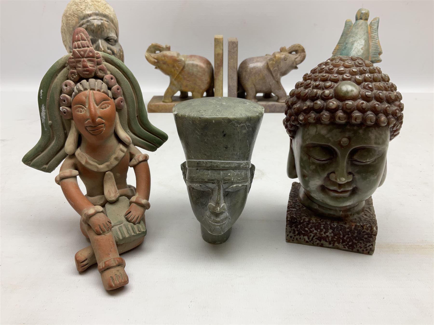 Pair of soapstone figural bookends carved with elephants, African soapstone bust, Buddha bust, Egyptian style etc, tallest H18cm