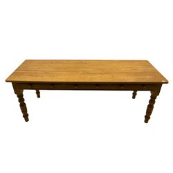 Farmhouse pine dining table, fitted with three drawers, turned legs
