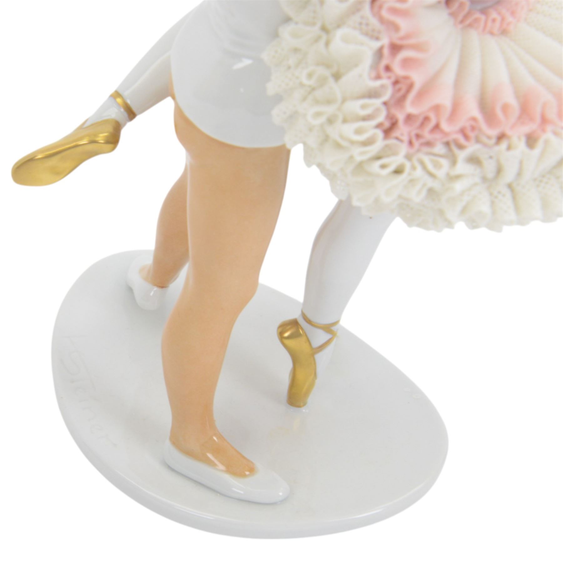 Unterweissbach lace figure, designed by K. Steiner, modelled as two ballerinas, the female figure with lace tutu, the male figure with lace cuffs, upon a shaped base with incised signature, with printed mark beneath, H26cm