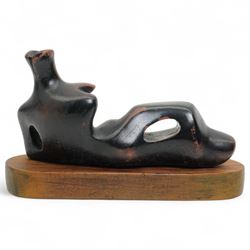 After Henry Moore (British 1898-1986): 'Reclining Figure', terracotta maquette sculpture, base marked with affixed catalogue label inscribed ‘Reclining Figure: 1939 Archive 0074229', W20cm H12cm
Notes: the original is on display at the Tate Britain