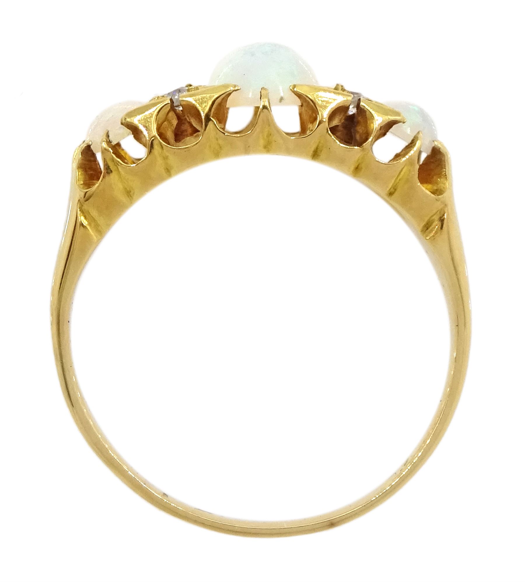 Victorian 18ct gold three stone opal ring, with four diamond accents set between