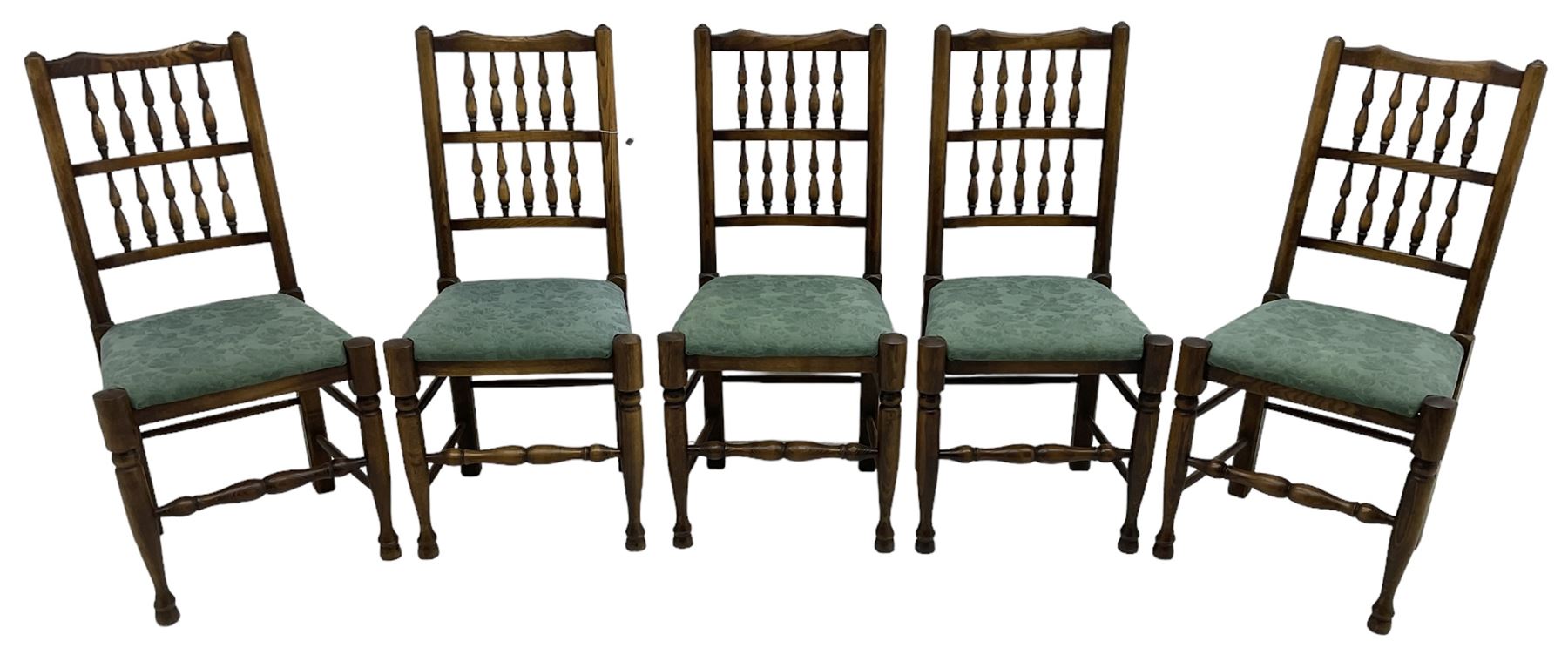 Set of five Lancashire design elm spindle back chairs, shaped cresting rail over two rows of five spindles, upholstered drop-on seats, on turned front supports united by turned stretchers  