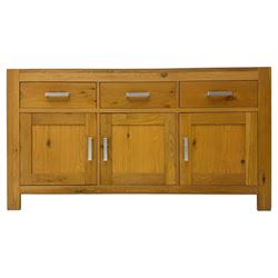 Light oak sideboard, fitted with three drawers and three cupboards, metal handles