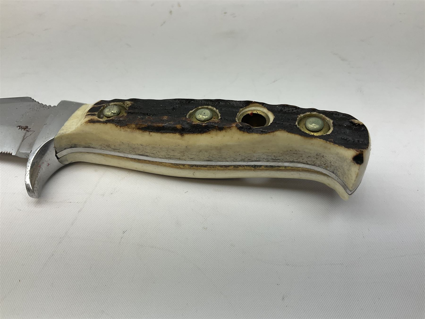 German Puma Skinner knife, the 13cm steel blade marked model 6393, serial No.55472 to guard, fixed blade, antler scales; in original hard plastic case; with brown leather sheath L29cm overall