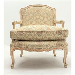 French style armchair, shaped and moulded frame in cream finish, upholstered in a cream ground fabric with classical urn and floral pattern, serpentine seat, cabriole supports