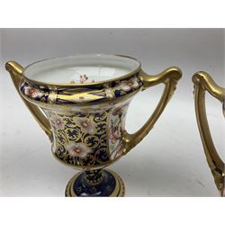 Pair of Royal Crown Derby 6299 Imari pattern twin handled trophy vases, of wasted cylindrical form, with printed mark beneath, H13cm 