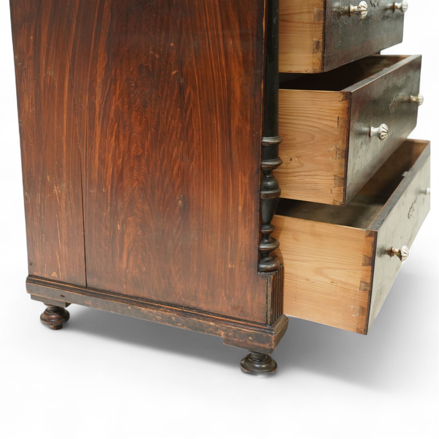 19th century painted pine chest of drawers, the rectangular top with moulded edge and painted floral decoration, above three drawers with later ceramic handles, with half turned column and reeded pilasters, upon turned compressed bun feet  
