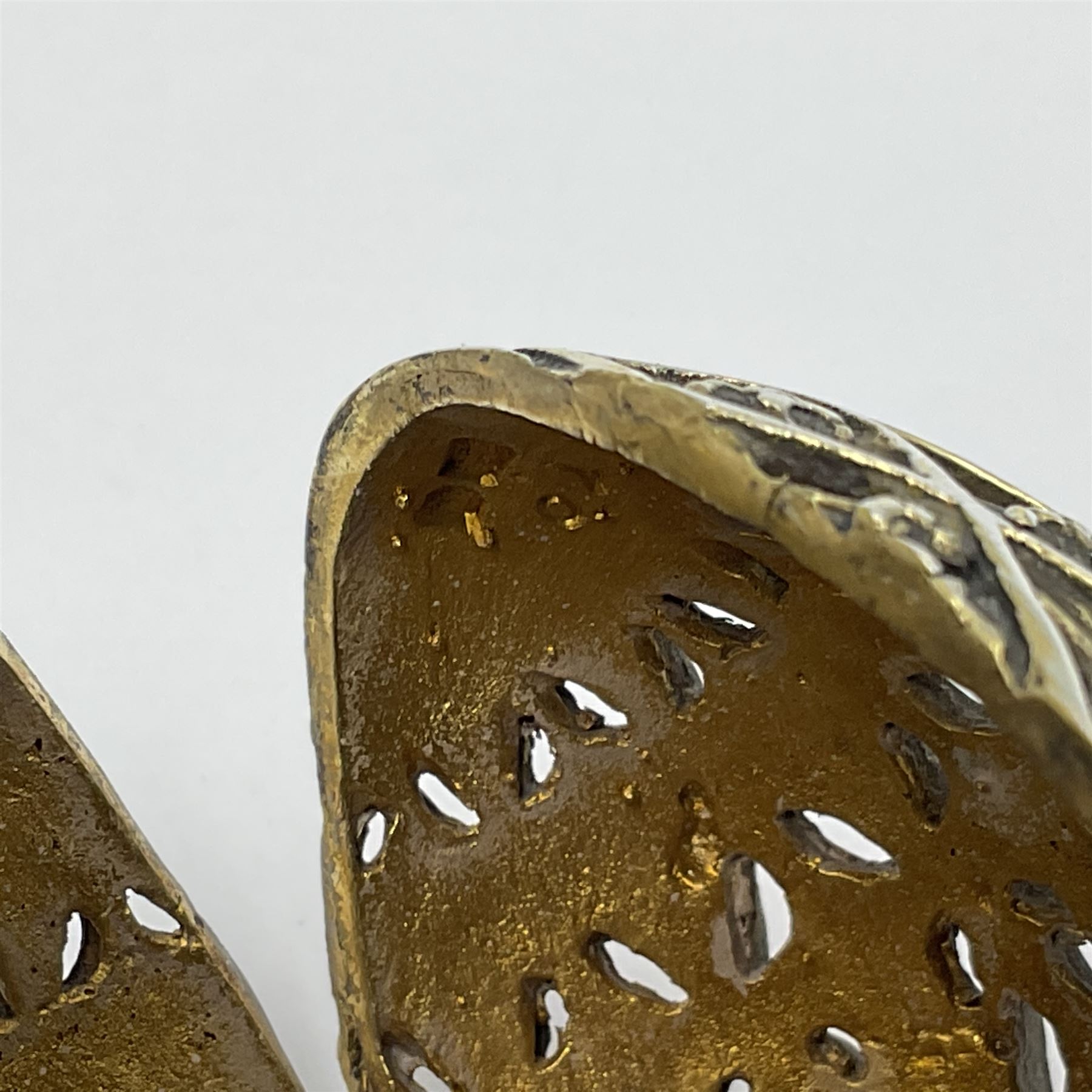 Modern silver limited edition Easter egg, no. 70/500, the openwork lattice body decorated with gilded panels of flower heads, opening to reveal a gilt interior, upon silver stand with three scrolling pad feet, each hallmarked St James House Company, London 1979, height including stand 8cm