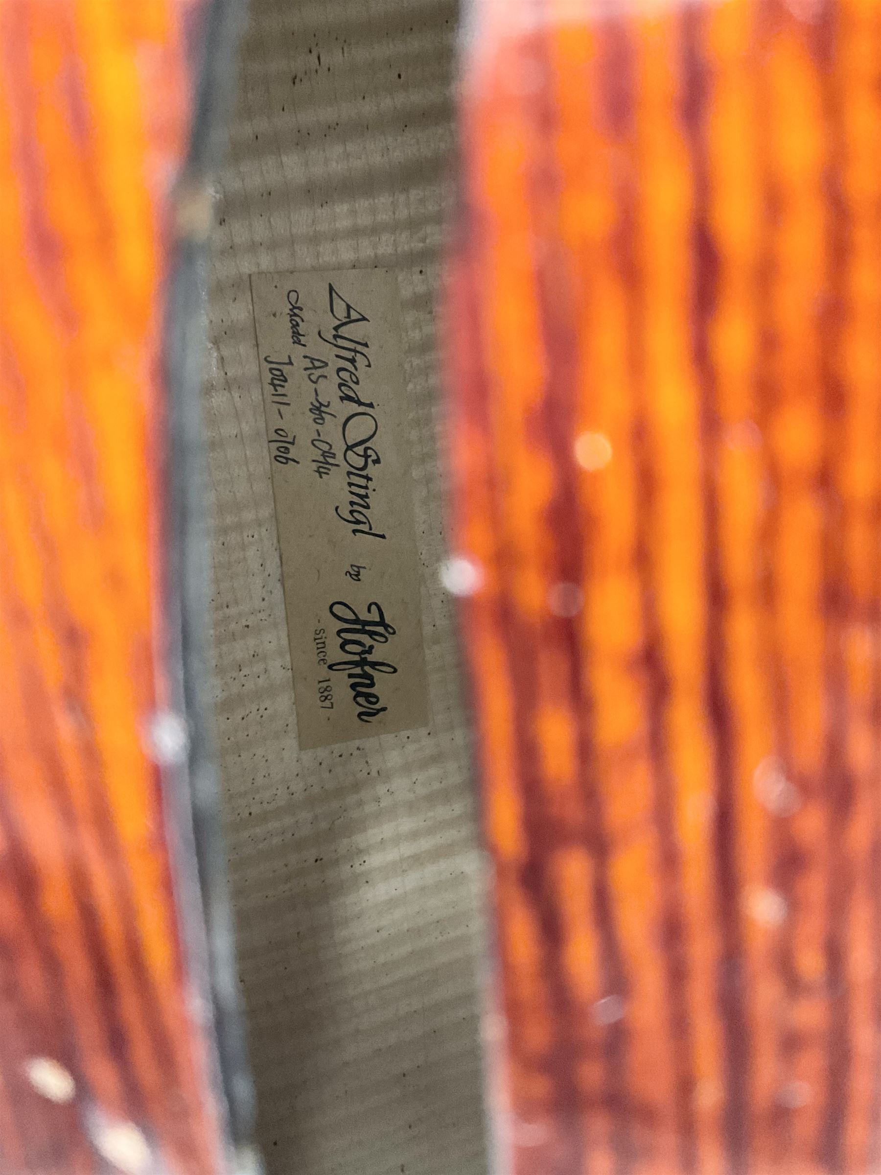 Alfred Stingl by Hofner cello, model AS-360 with 75.5cm two-piece maple back and ribs and spruce top, bears label with serial no.JO411-0706, L122cm; in carbon-fibre carrying case with bow