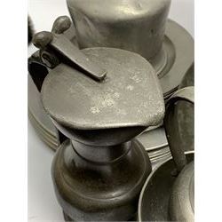 Collection of 18th and 19th century pewter, comprising two chargers, eight large plates, twenty six smaller plates, two bowls, three lidded measures, two jugs, tappit hen, and tankard, the plates with various marks and touch marks, including pseudo 'hallmarks', largest charger 37cm, large plates D30cm, smaller plates D24.5cm, tappit hen H26.5cm