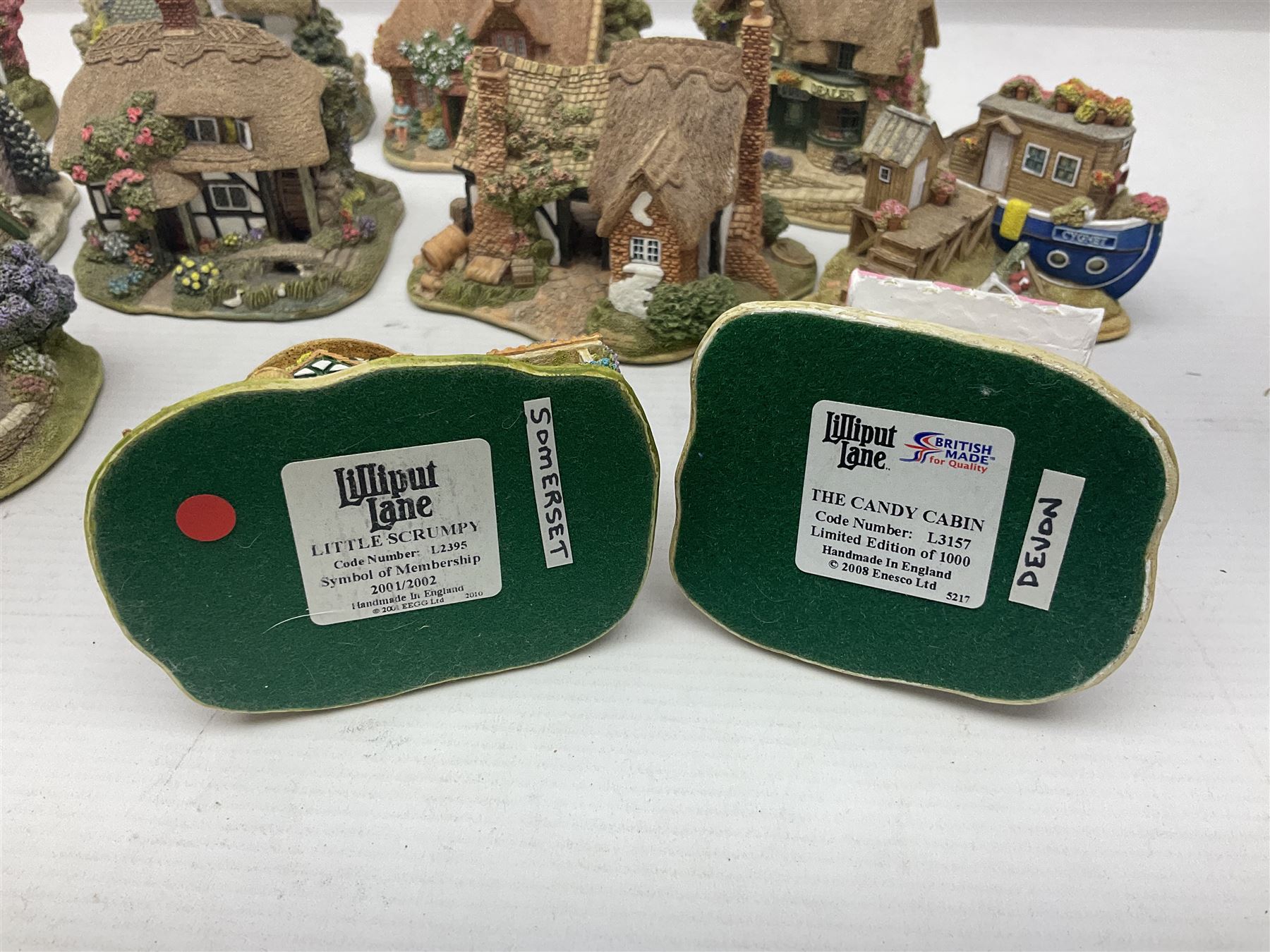 Eighteen Lilliput Lanes, including The Penny Farthing, The Pigsty, Borrowdale School, Fairy Cake Tearoom, An Apple a Day,Ladybird Cottage etc, all with original boxes 