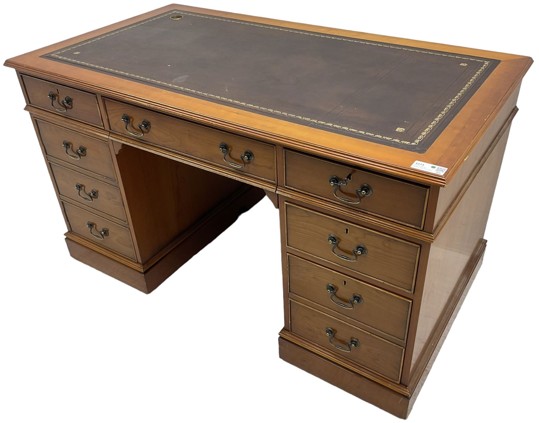 Cherrywood twin pedestal desk, rectangular leather inset top over central fall front with keyboard slide and two drawers, fitted with two drawers and cupboard, on bracket feet