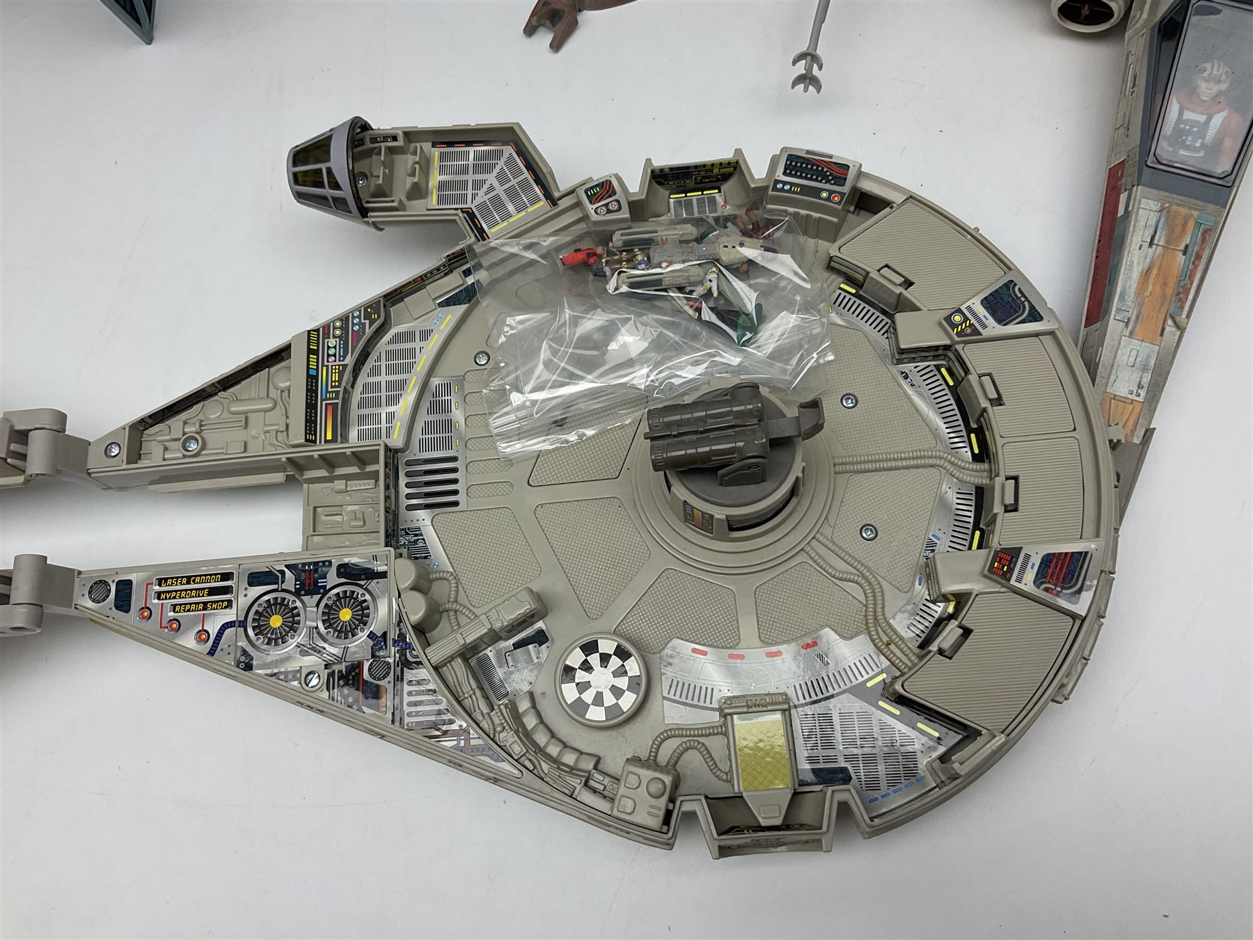 Star Wars - four space/land vehicles comprising Millenium Falcon with hinged top and figures; TIE Fighter; X-Wing Fighter with pilot; and AT-ST 'Chicken Walker' transporter; all unboxed (4)