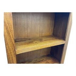 Contemporary Dakota mango wood open bookcase, rectangular form with four fixed open shelves, raised on stile supports