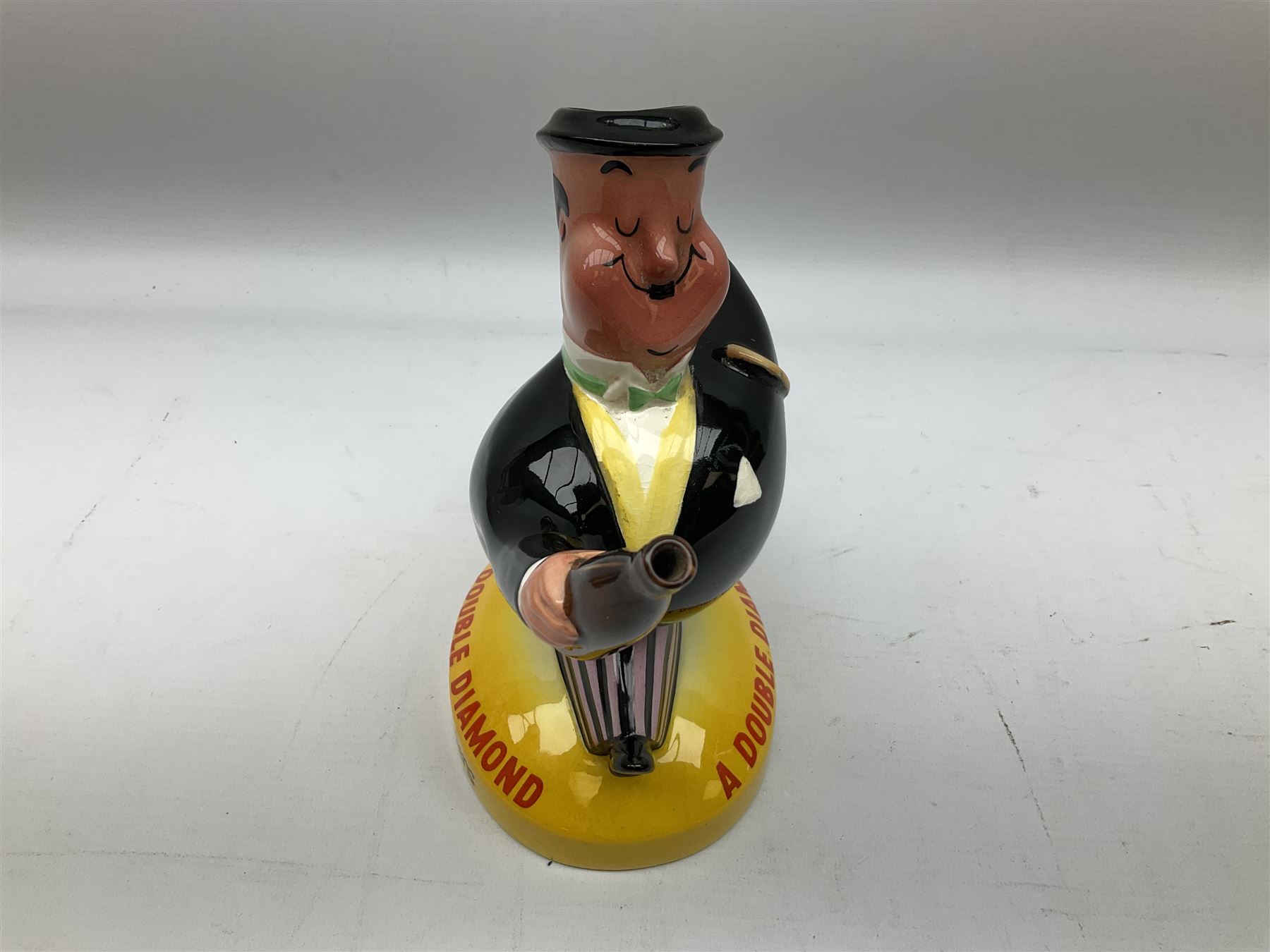 Beswick 'Double Diamond Works Wonders' advertising decanter in the form of a business man with briefcase and bottle, with impressed and printed marks beneath