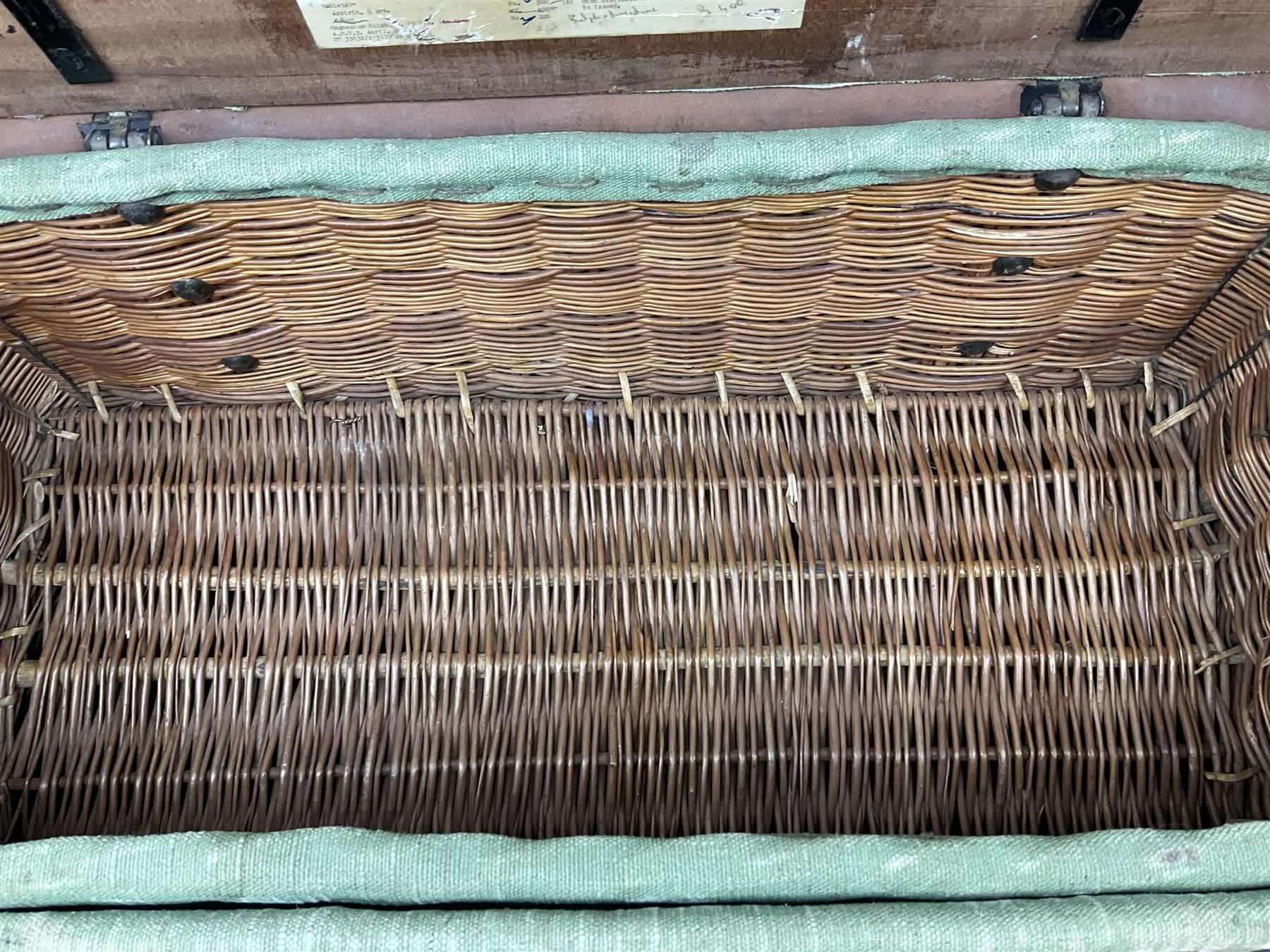WW2 British Army RAMC 'Regimental Medical Pannier', well marked externally and dated 1941, stamped May 1943 internally, canvas covered wicker form with leather edges, hinged top and fall front with two rope carrying handles, fitted iron locking straps with securing chains; contains various unused field dressings and bandages with WW2 dates and two pillows; original label under lid L79cm