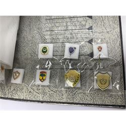 Large collection of approximately one hundred and eighty enamel badges and pins, relating to British and World football clubs, including loose examples and examples housed in folders, mostly identified