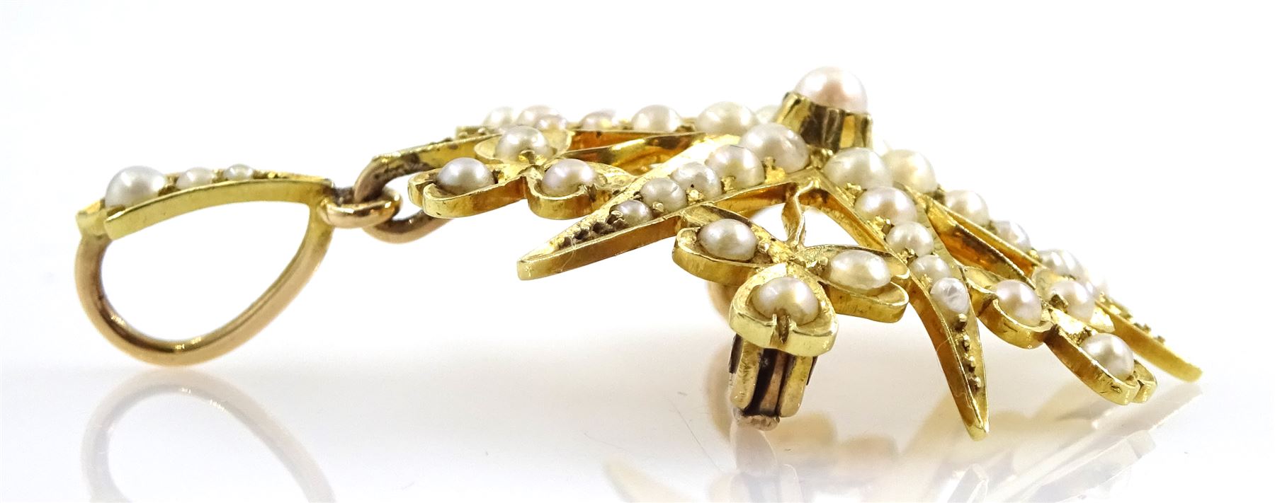 Edwardian 18ct gold split seed pearl star pendant