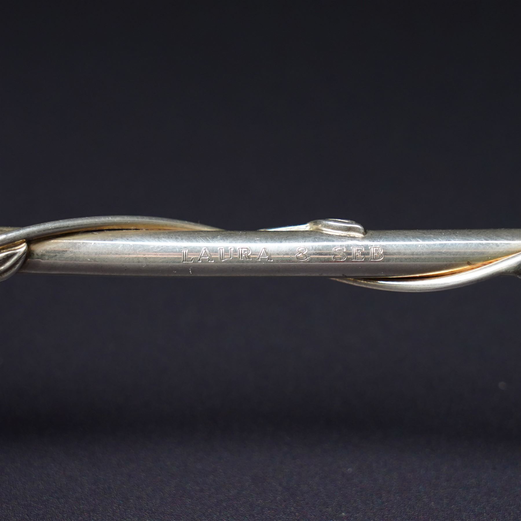 A pair of Tiffany & Co. novelty silver drinking straws, each modelled as a bamboo stem entwined with leaves and applied with a climbing monkey figure, engraved with names and date, stamped TIFFANY & CO. 925, W21cm