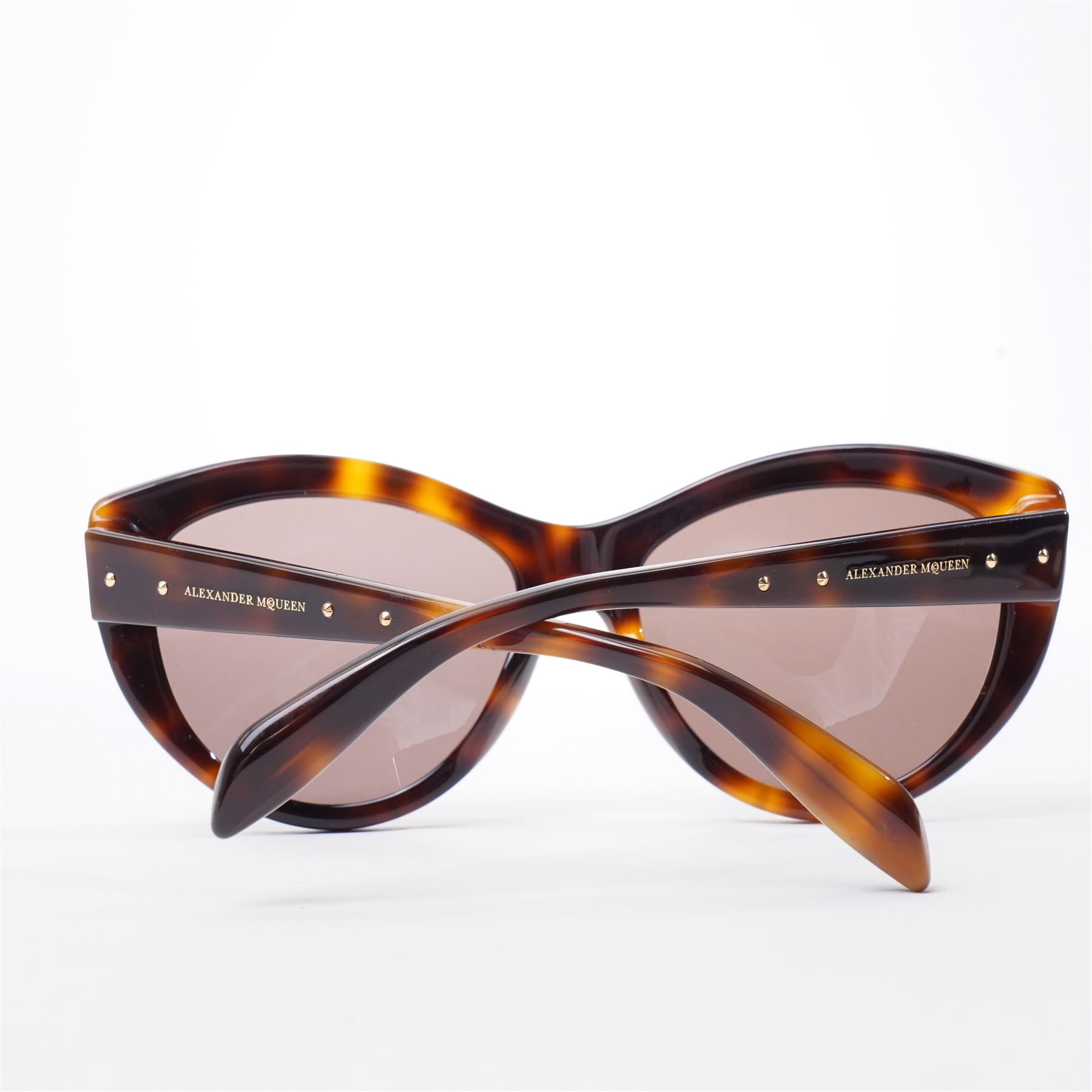 Alexander McQueen - pair of oversized sunglasses, with tortoiseshell-effect acetate frames and gradient tinted lenses, the fronts studded with gold-tone metal rivets, the arms signed ‘Alexander McQueen’, with original hard case and box