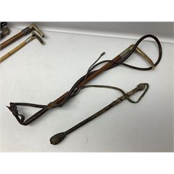 Collection of hunting crops and riding whips, including horn handle examples with silver cuffs