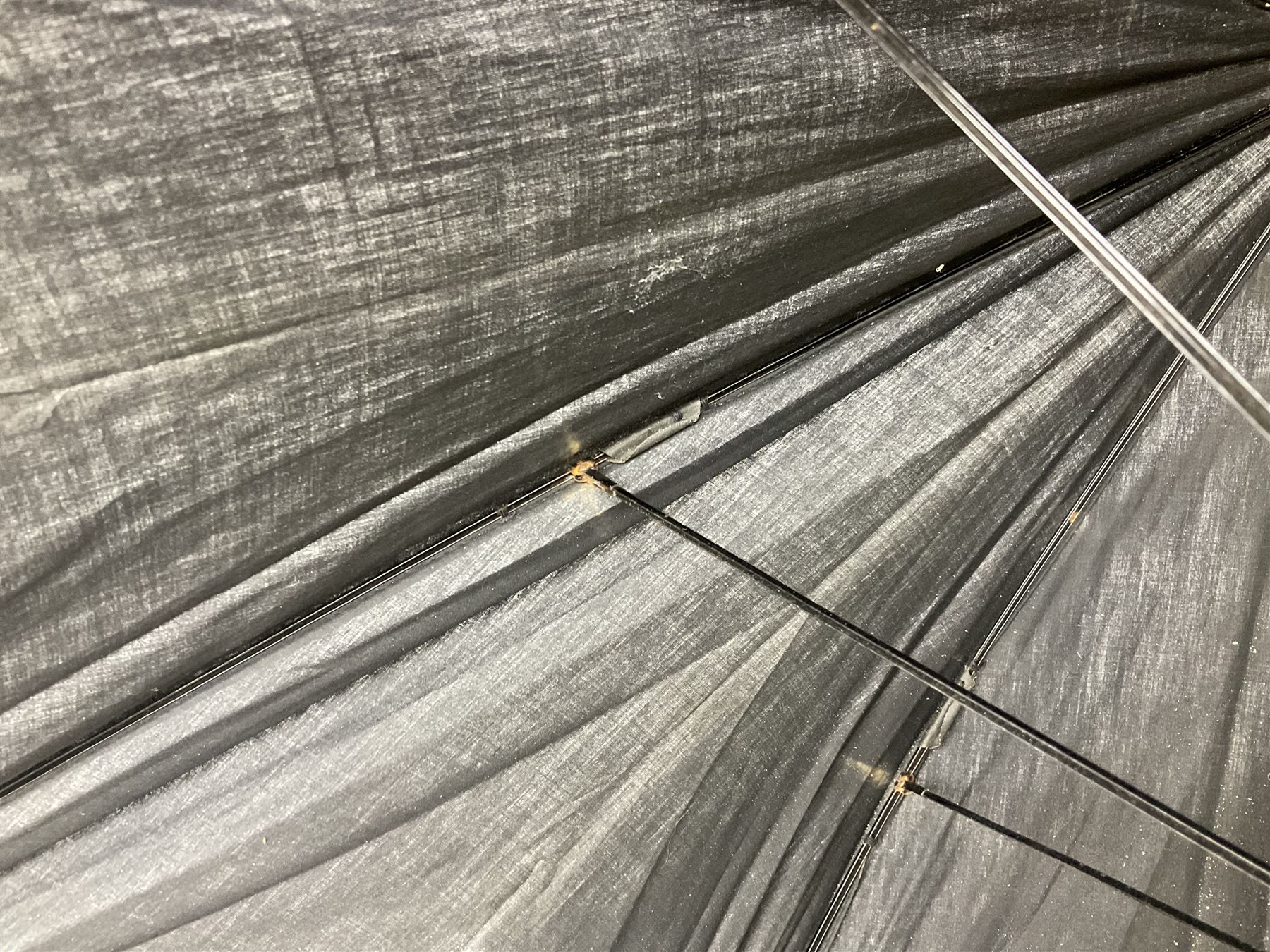 Early 20th century curved horn handle walking stick with hallmarked silver mounts, engraved L Russell 1918, together with a shooting stick by William Mills Birmingham, with leather handle, 'The Featherwaite' shooting stick and an umbrella with wooden handle