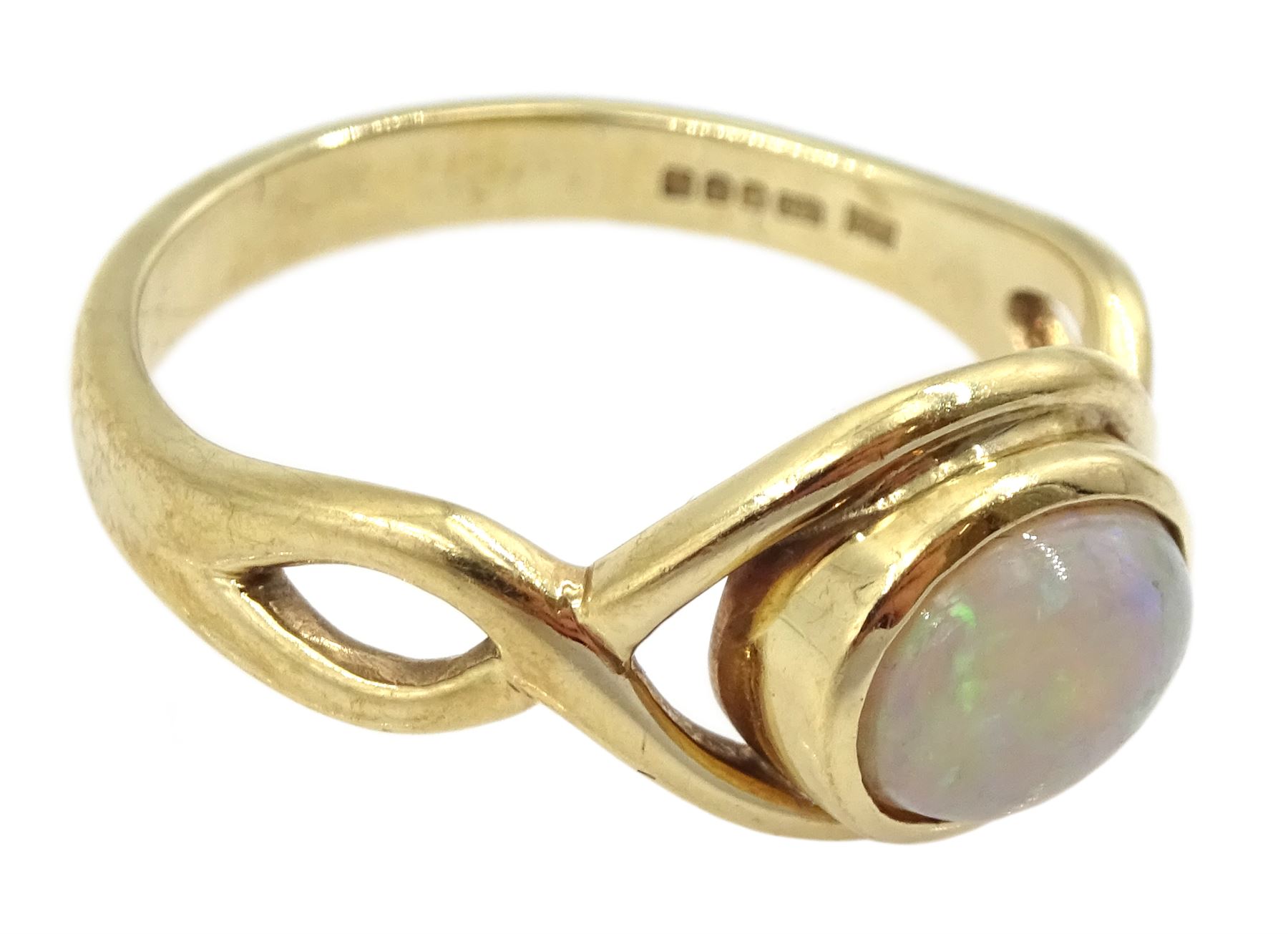 9ct gold single stone opal ring, with crossover design shoulders, Sheffield 2005